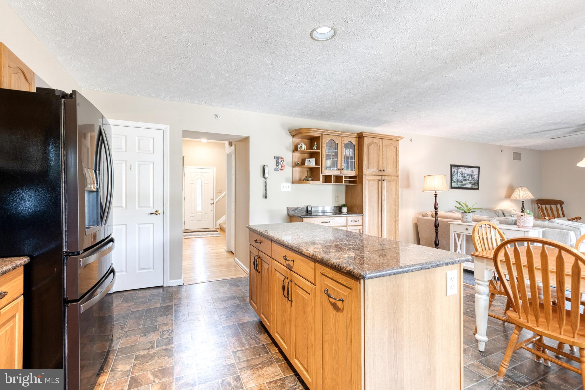 16 Perry Ridge Court Baltimore, MD 21237 - Photo 13 of 45 a kitchen with stainless steel appliances granite countertop a refrigerator a stove and a sink with large cabinets