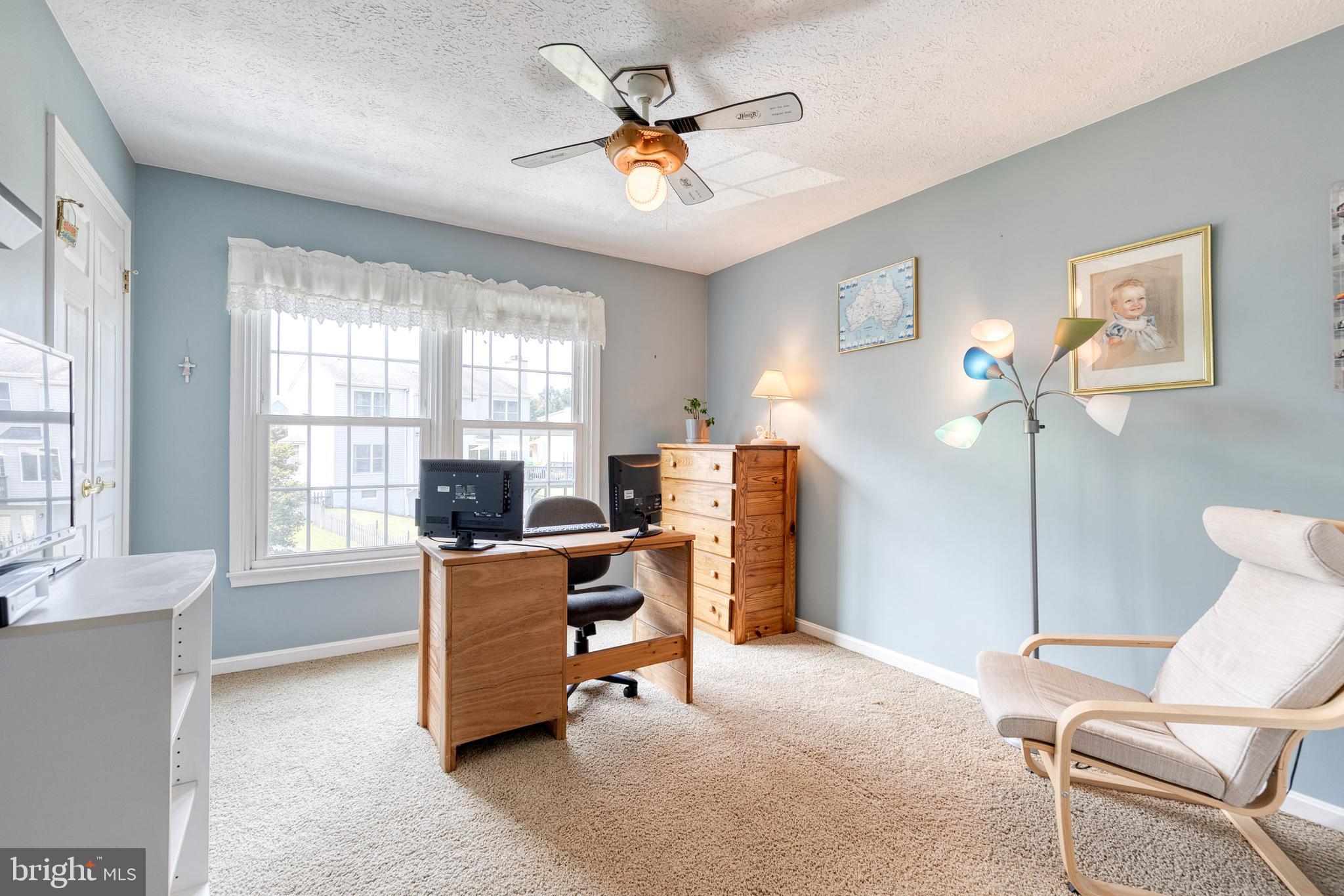 16 Perry Ridge Court Baltimore, MD 21237 - Photo 26 of 45 a view of a workspace with furniture and a window