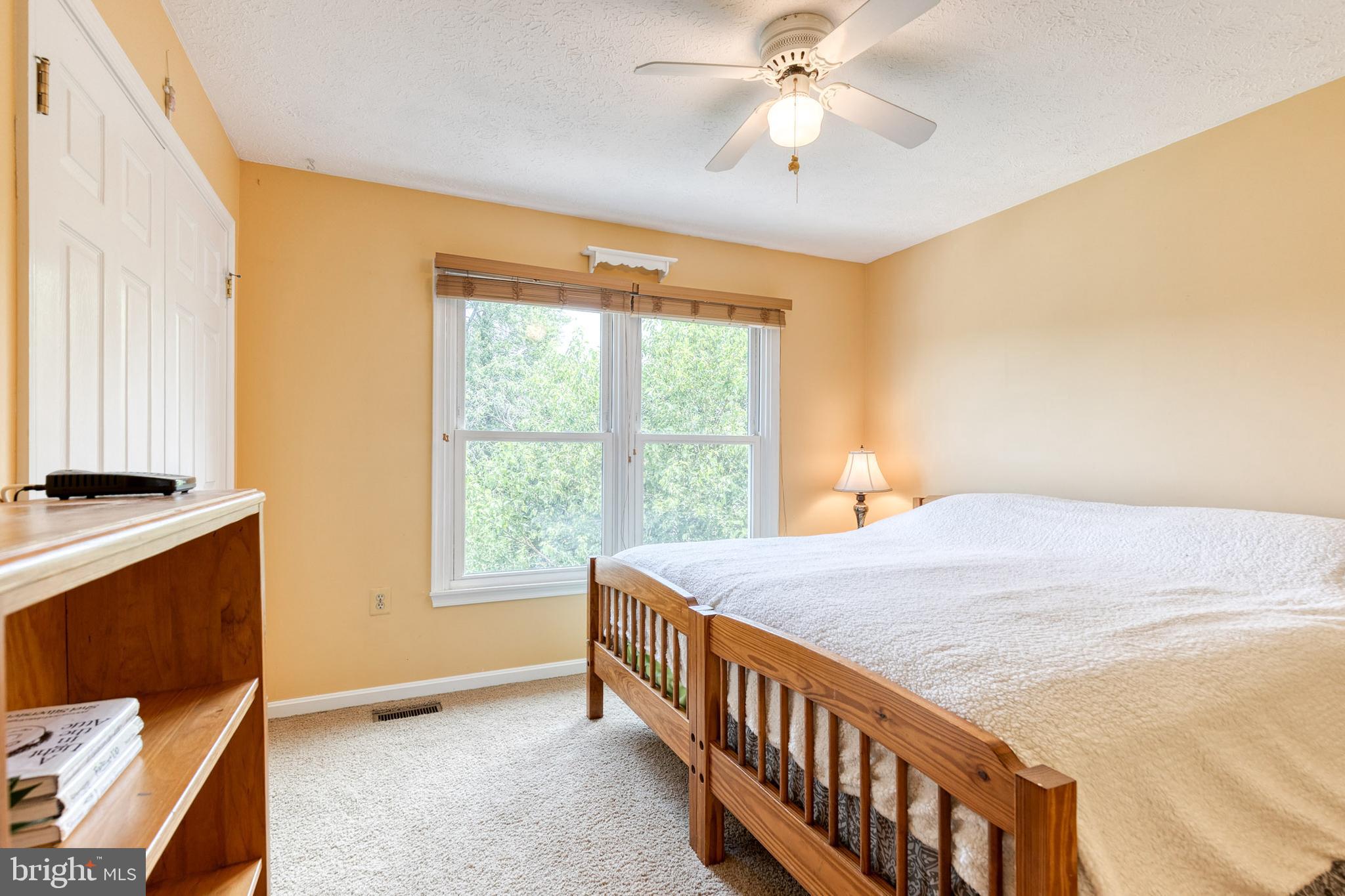 16 Perry Ridge Court Baltimore, MD 21237 - Photo 27 of 45 a bedroom with a bed and a window