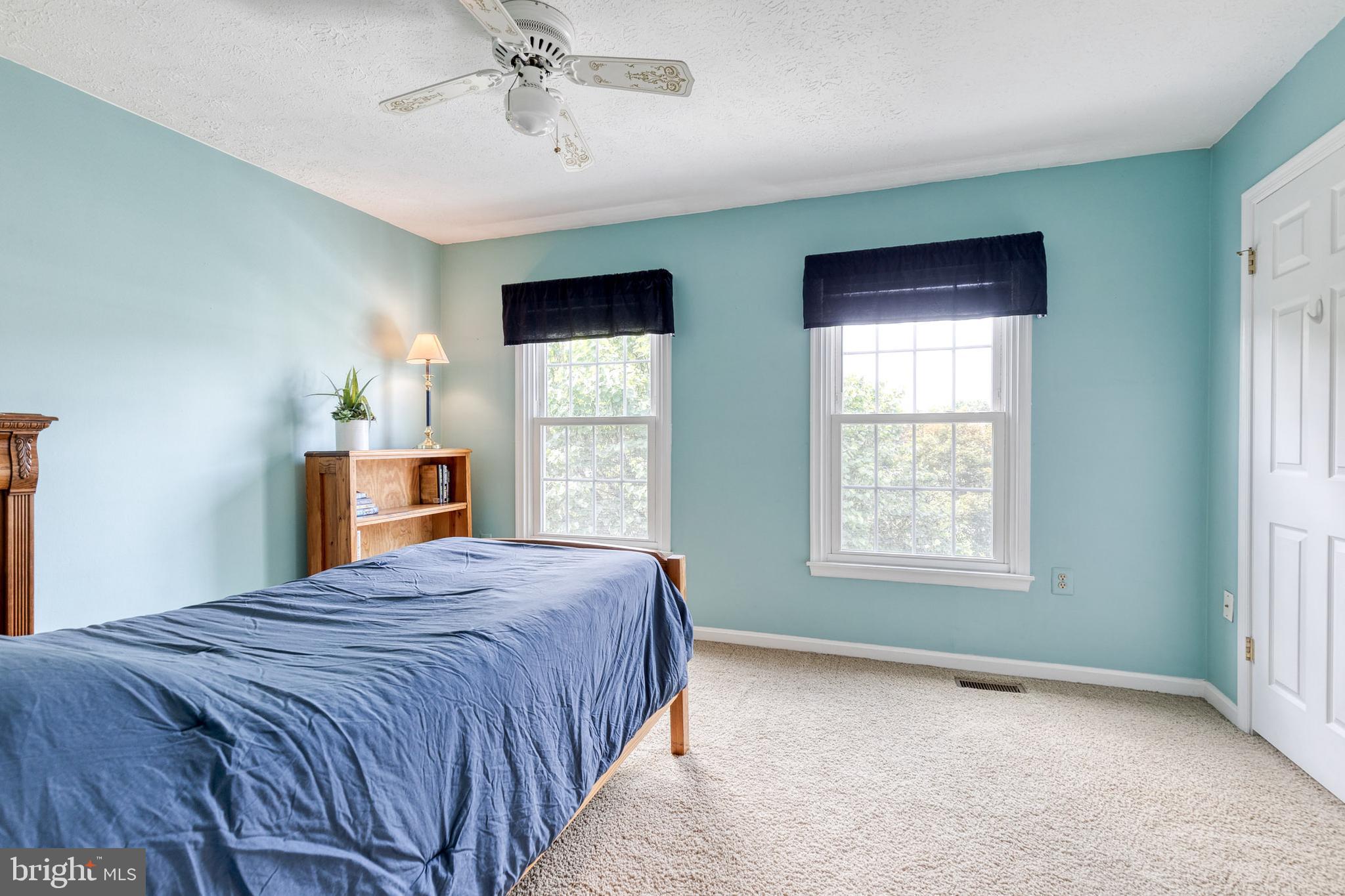 16 Perry Ridge Court Baltimore, MD 21237 - Photo 28 of 45 a bedroom with a bed and window