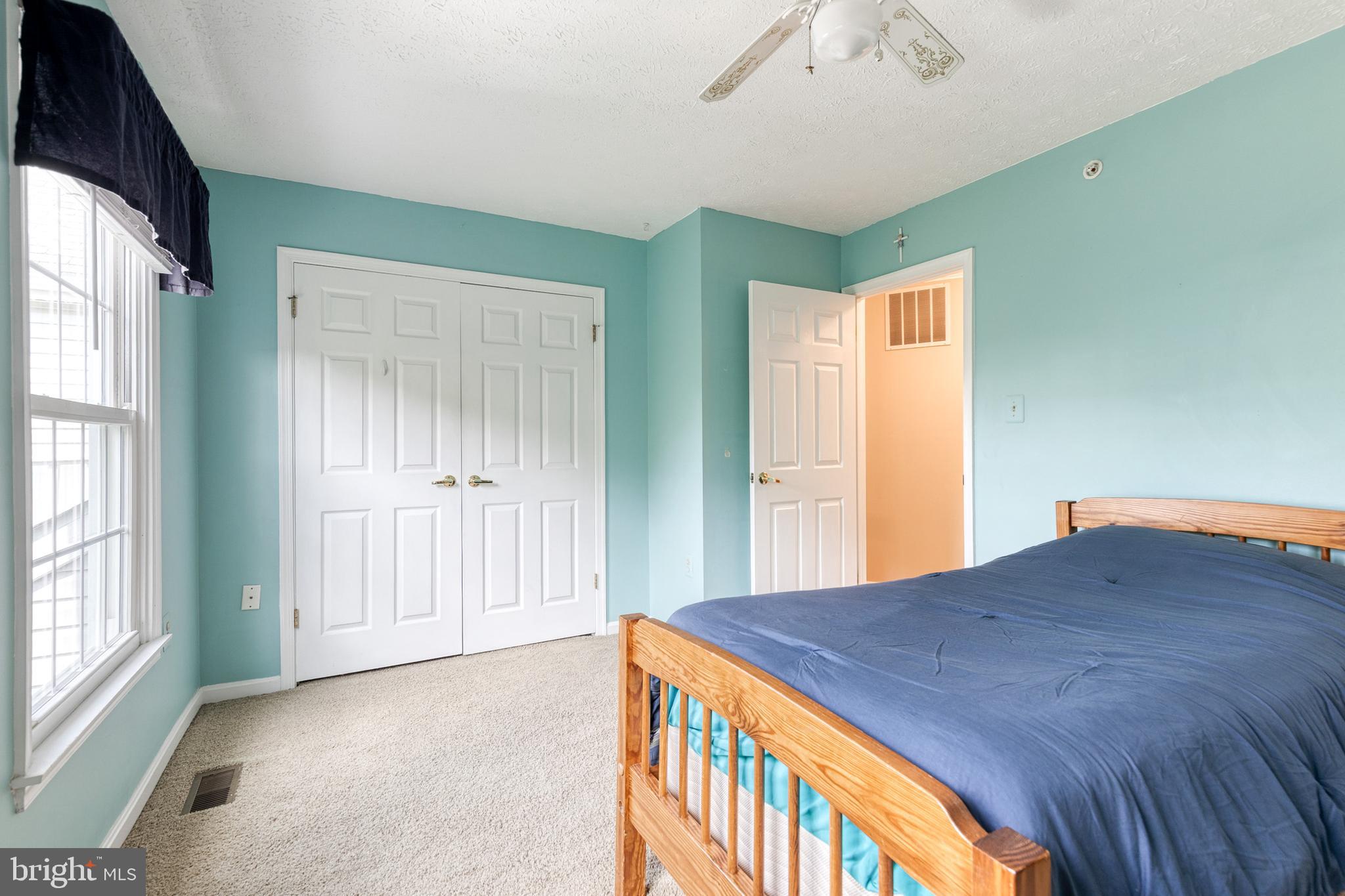 16 Perry Ridge Court Baltimore, MD 21237 - Photo 29 of 45 a bedroom with a bed and a window