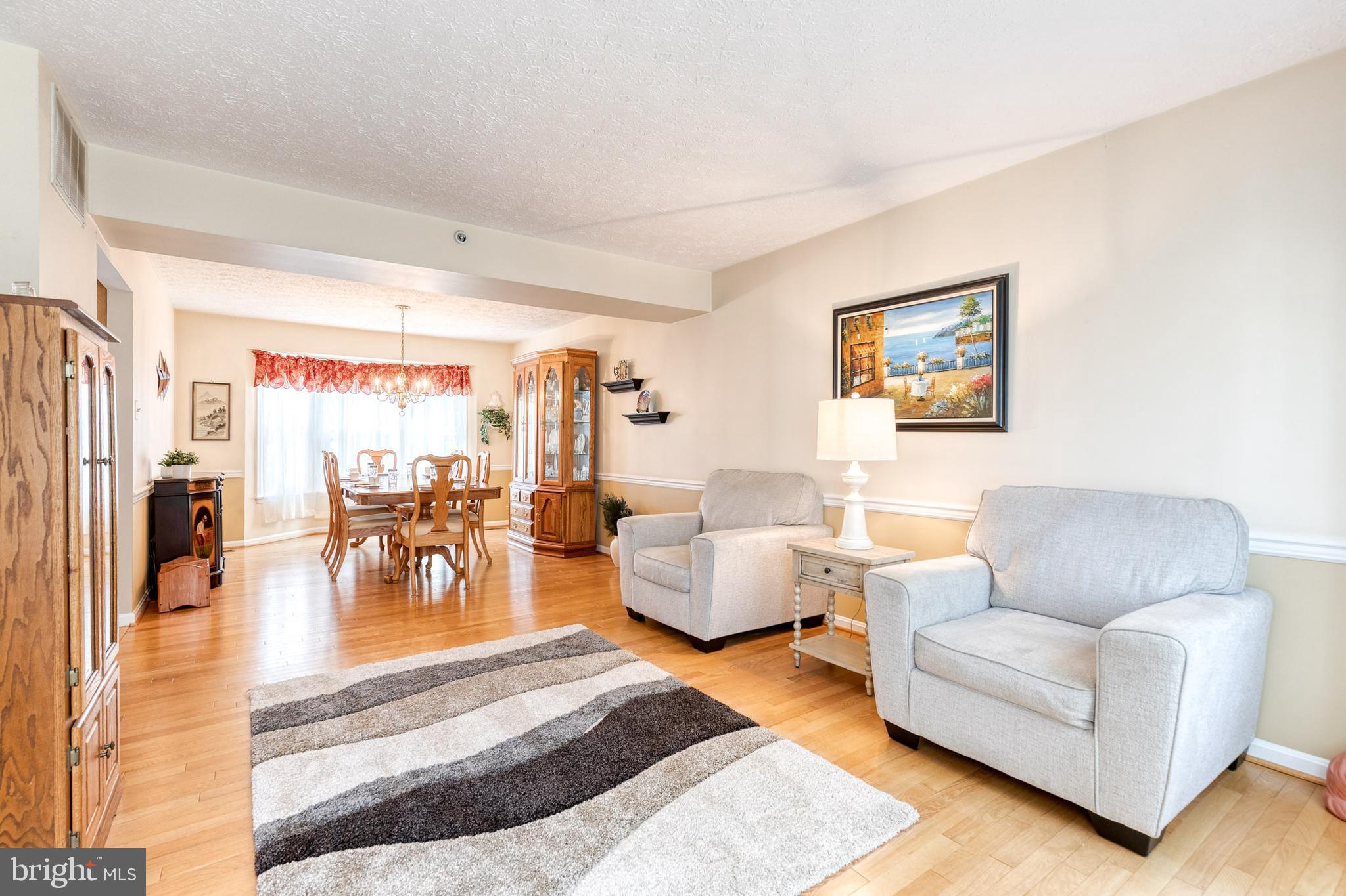 16 Perry Ridge Court Baltimore, MD 21237 - Photo 3 of 45 a living room with furniture and a view of kitchen