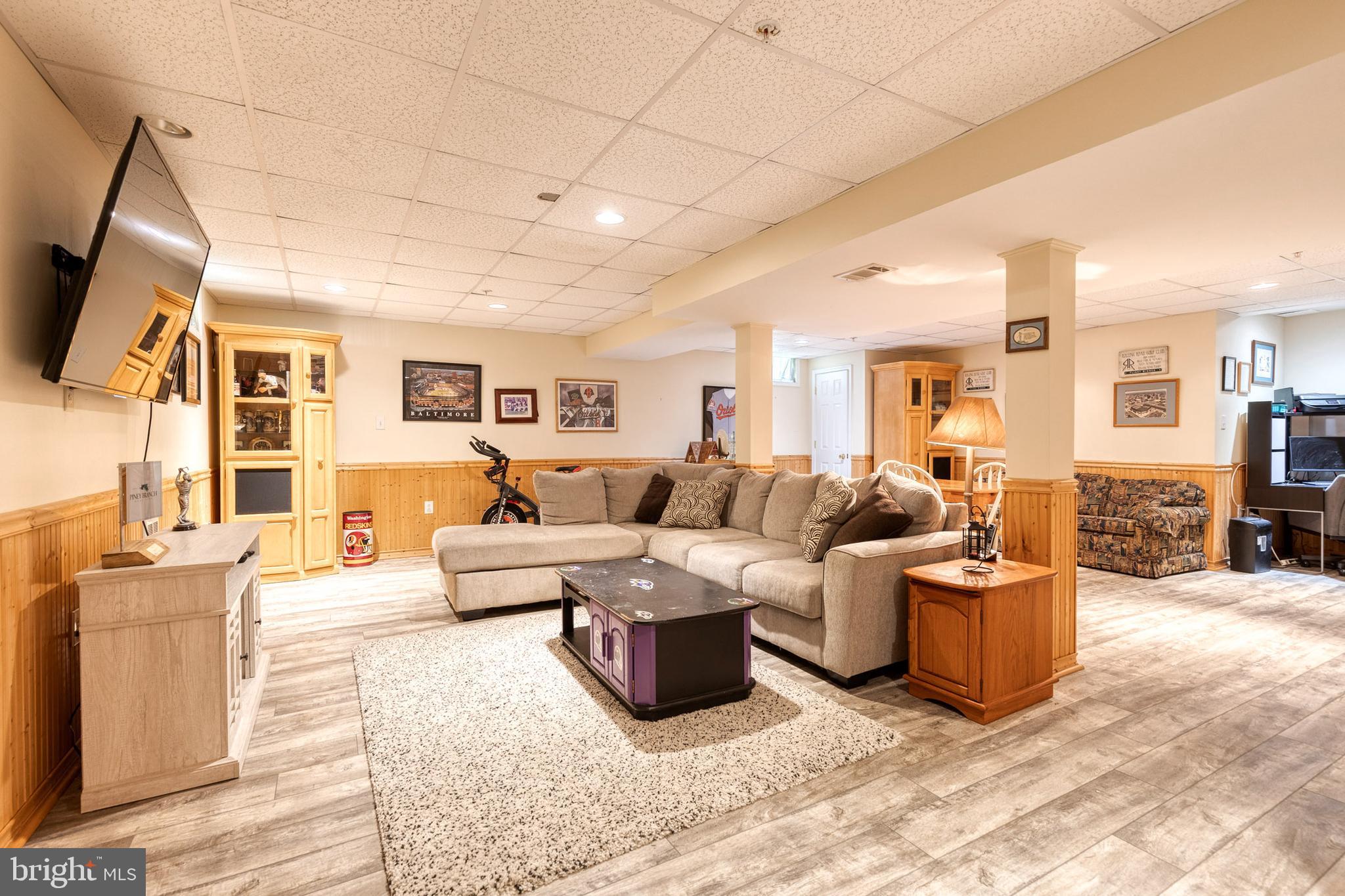 16 Perry Ridge Court Baltimore, MD 21237 - Photo 34 of 45 a living room with furniture and a flat screen tv