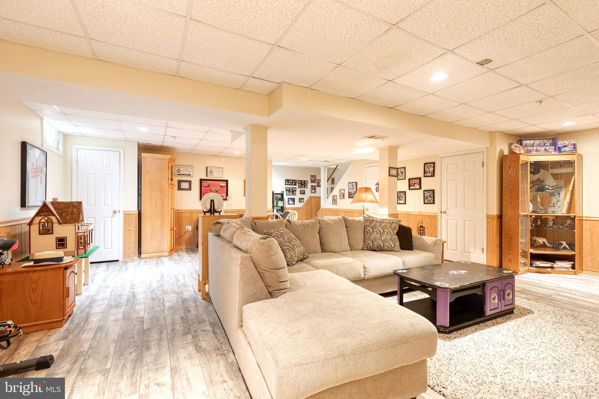 16 Perry Ridge Court Baltimore, MD 21237 - Photo 35 of 45 a living room with furniture and a wooden floor