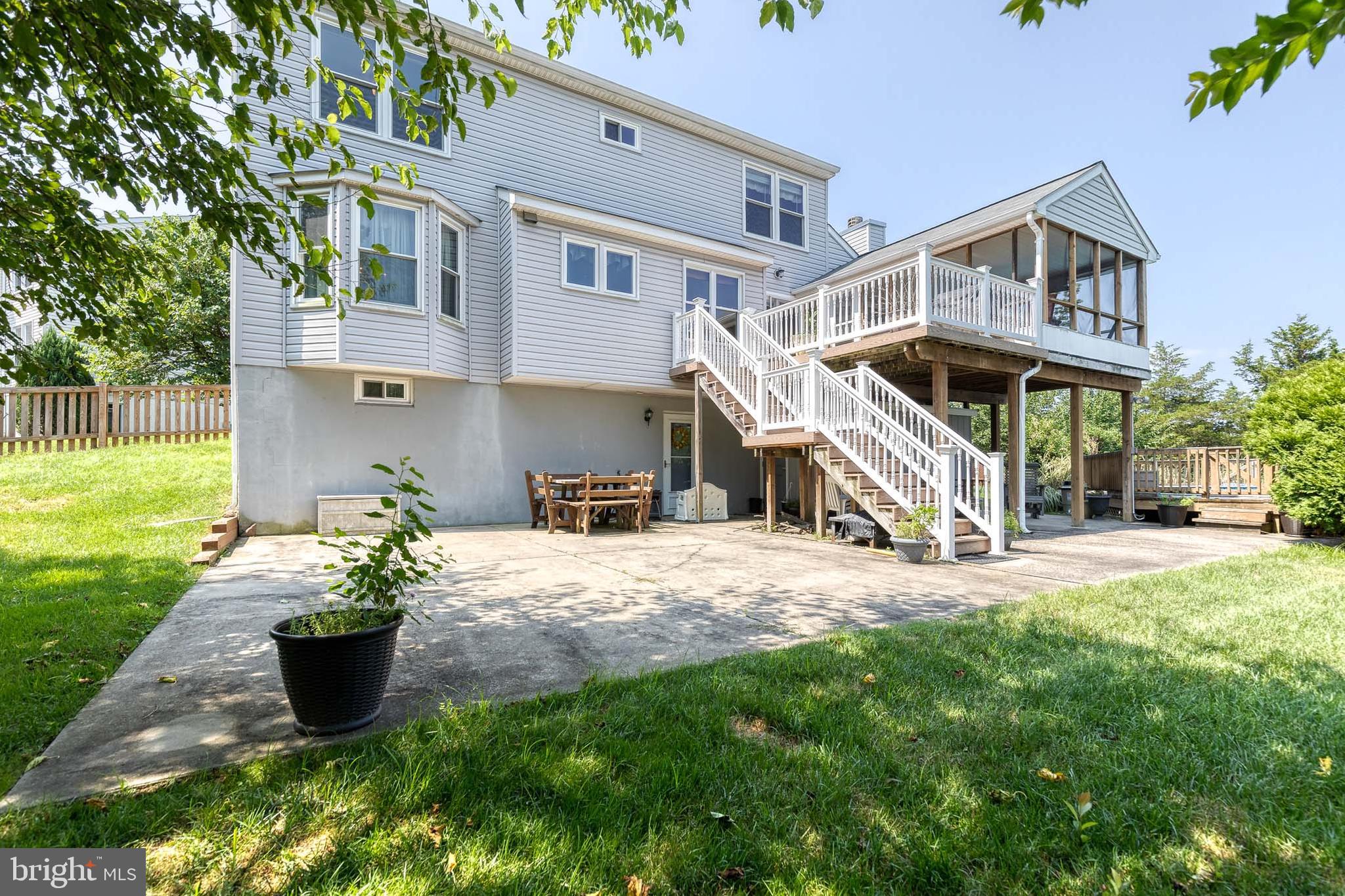 16 Perry Ridge Court Baltimore, MD 21237 - Photo 42 of 45 a view of a house with a yard and a garden