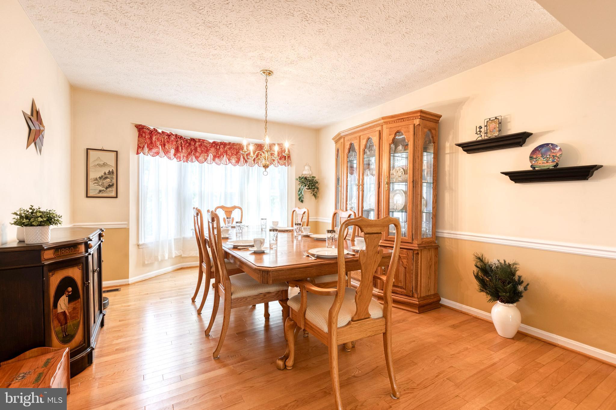 16 Perry Ridge Court Baltimore, MD 21237 - Photo 6 of 45 a dining room with furniture window wooden floor
