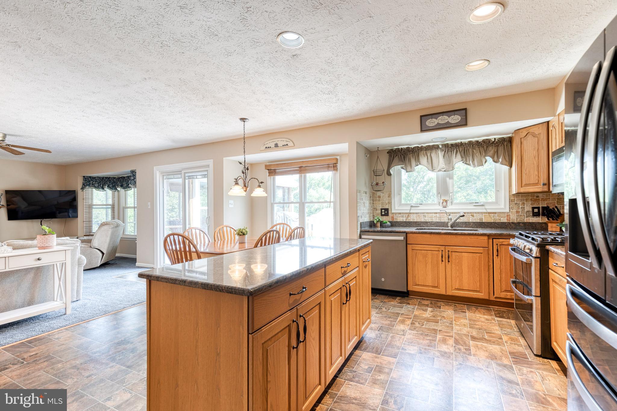 16 Perry Ridge Court Baltimore, MD 21237 - Photo 10 of 45 a kitchen with counter top space and living room