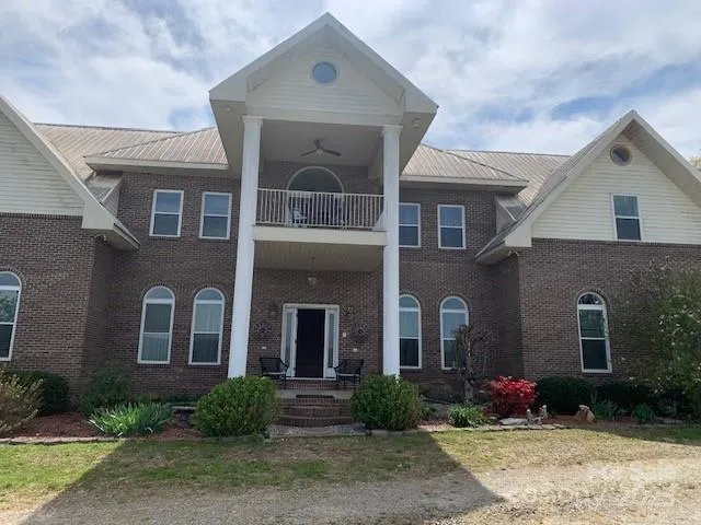 a front view of a house with yard