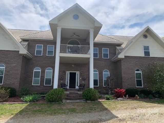 a front view of a house with yard