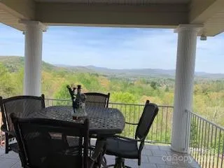 a bedroom with bed and wooden floor