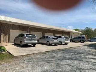 a view of a patio with furniture and garden