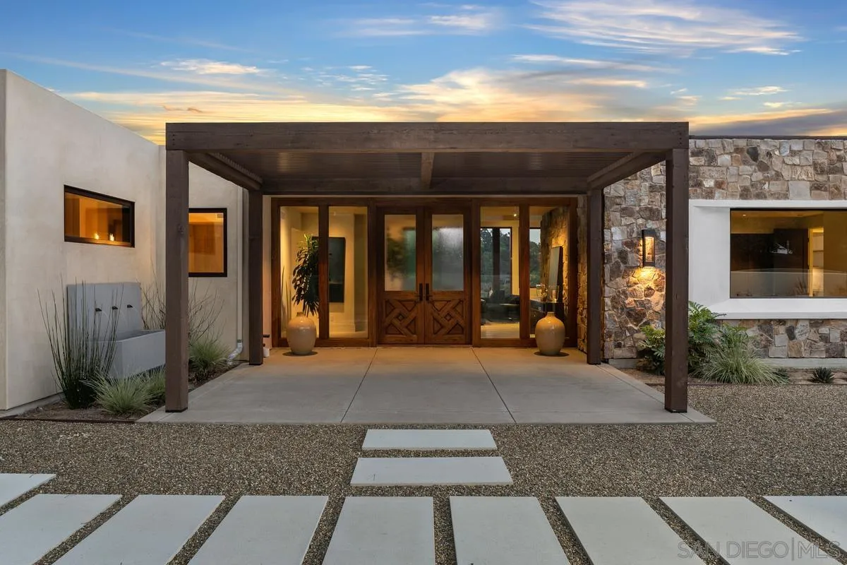 4728 El Aspecto Rancho Santa Fe, CA 92067 - Photo 14 of 34 a view of a building with door and glass windows