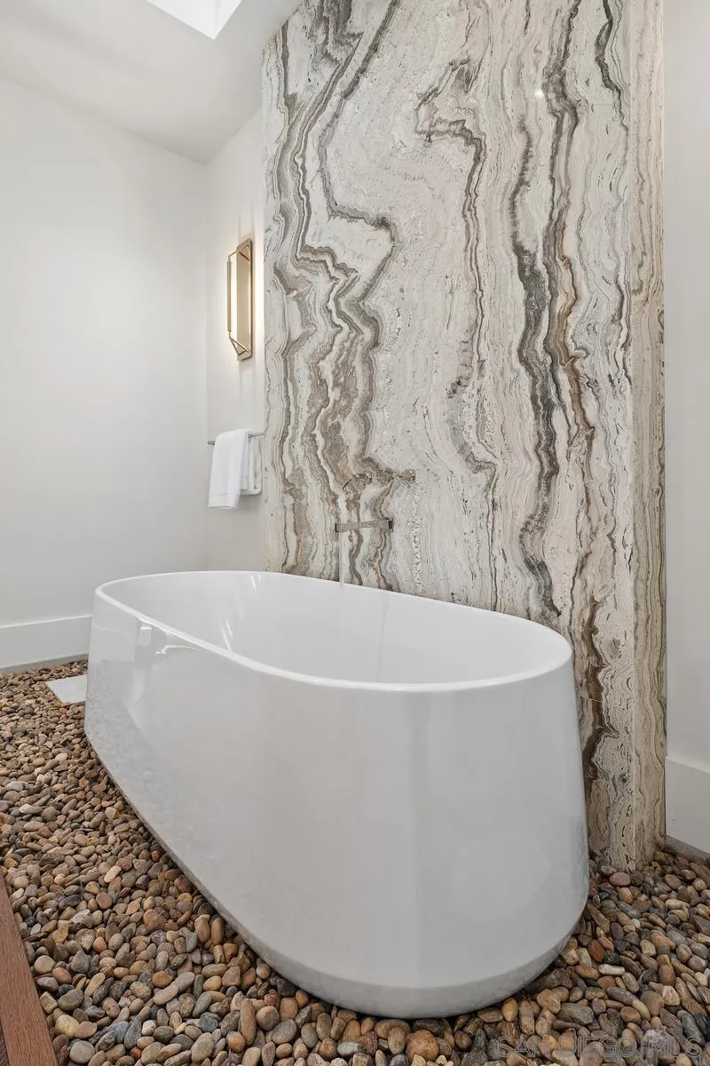 4728 El Aspecto Rancho Santa Fe, CA 92067 - Photo 21 of 34 a white bath tub sitting in a bathroom