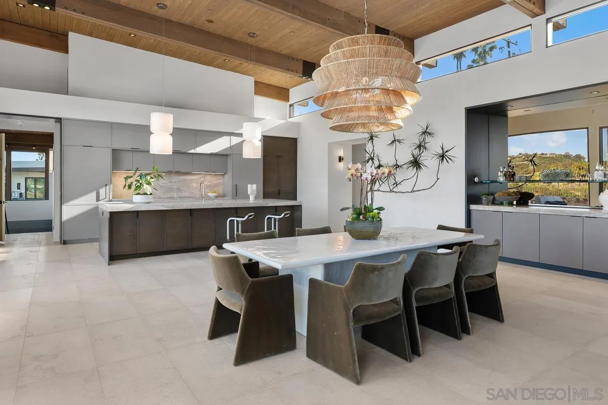 4728 El Aspecto Rancho Santa Fe, CA 92067 - Photo 32 of 34 a dining room with a table and chairs
