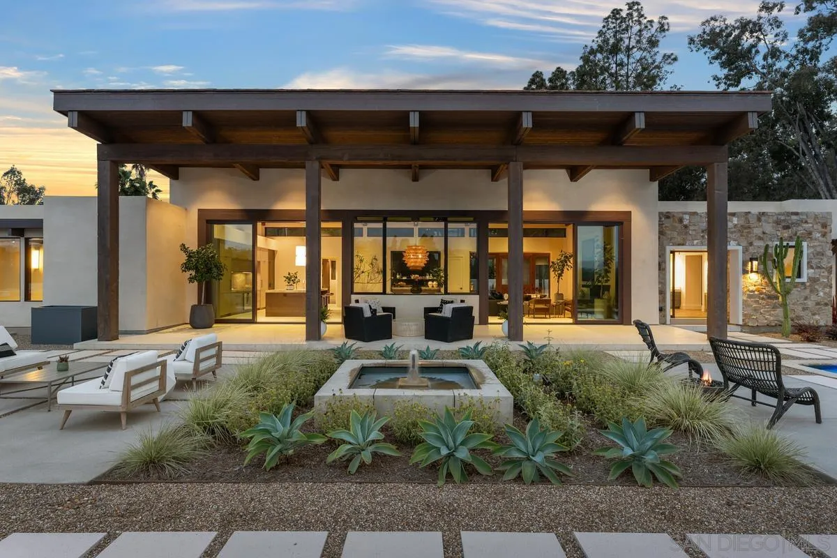 4728 El Aspecto Rancho Santa Fe, CA 92067 - Photo 4 of 34 a front view of a house with outdoor seating