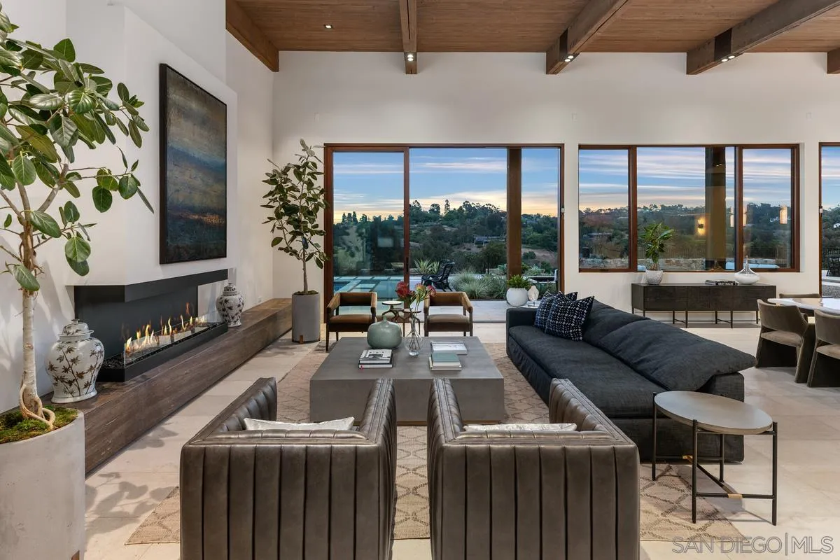 4728 El Aspecto Rancho Santa Fe, CA 92067 - Photo 6 of 34 a living room with furniture and a floor to ceiling window
