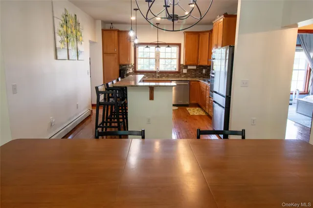 a view of a room with wooden floor and staircase