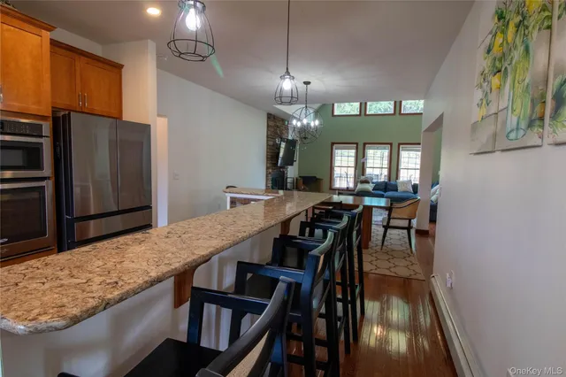 a large kitchen with a table and chairs