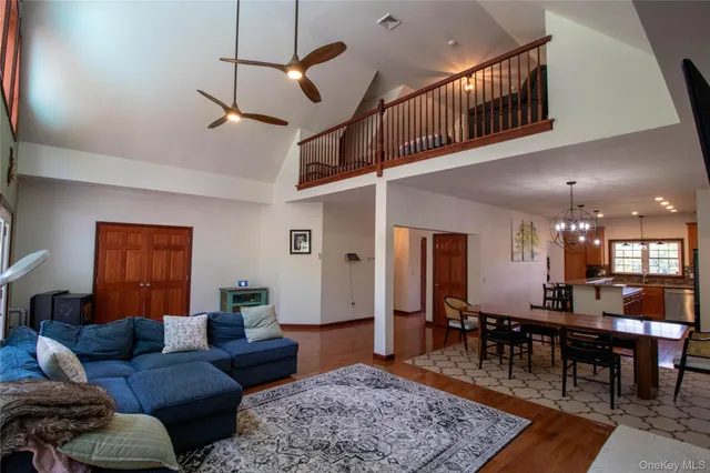 a living room with furniture a rug and a table