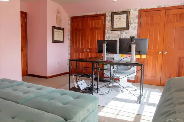 a work room with furniture and a window