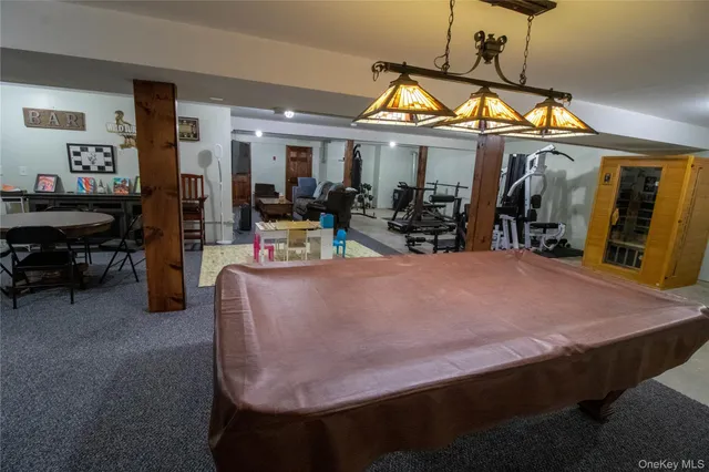 a living room with furniture a rug and a window