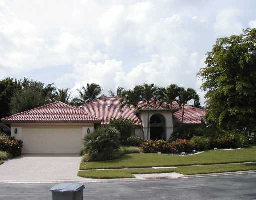 6702 Newport Boca Raton, FL 33496 - Photo 1 of 2 a front view of a house with a garden
