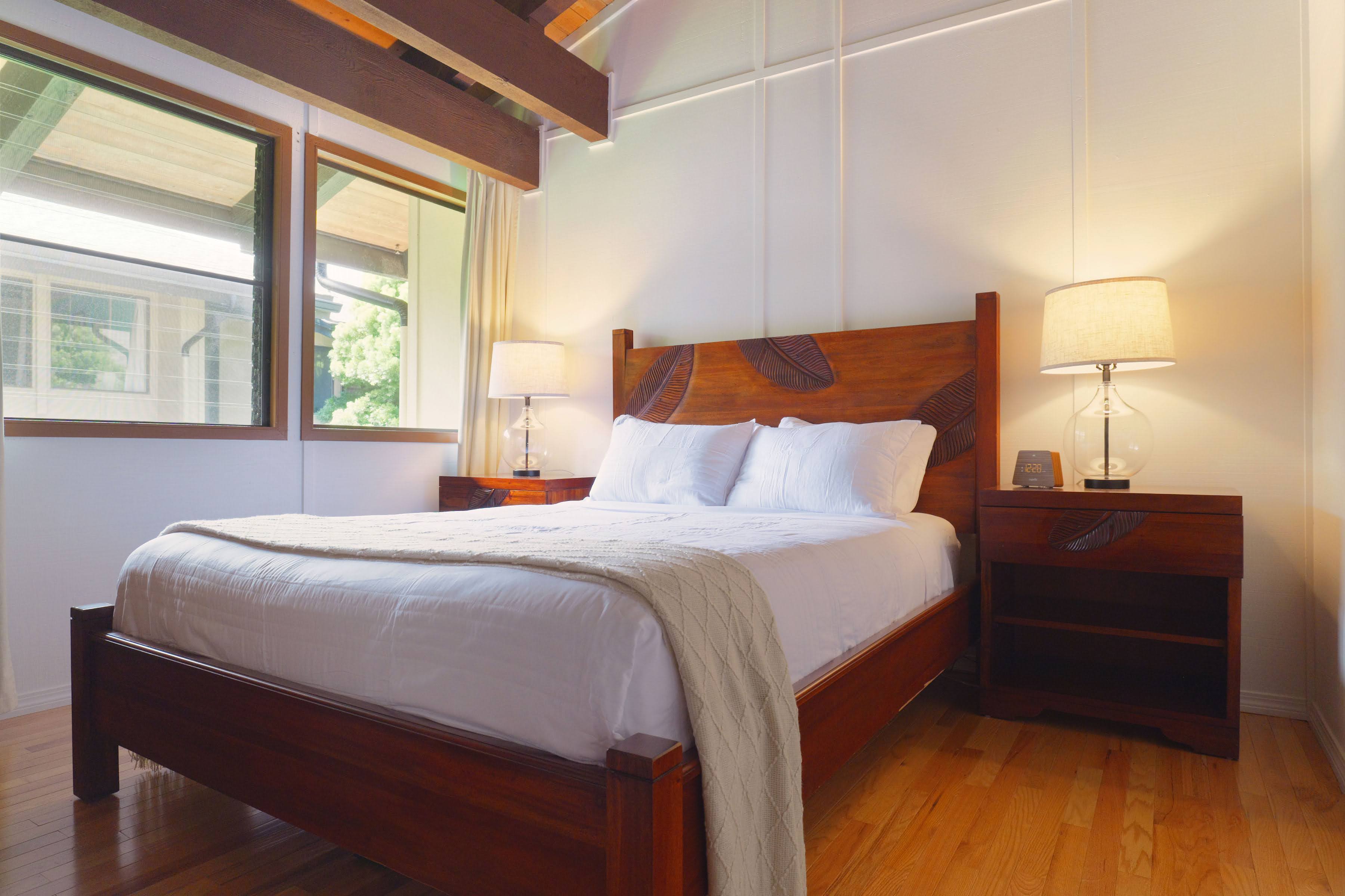 3920 Wyllie Road, Unit F20 Princeville, HI 96722 - Photo 13 of 25 a bedroom with a bed and a window