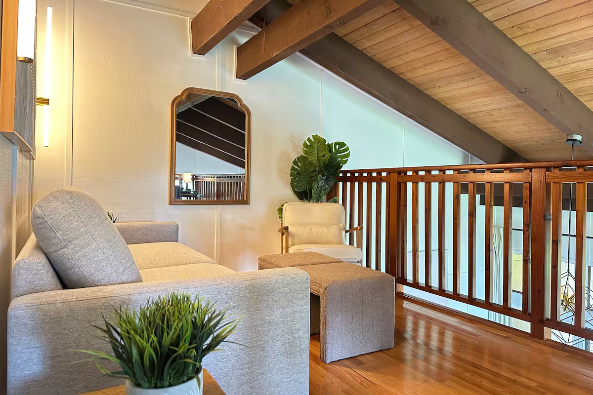 3920 Wyllie Road, Unit F20 Princeville, HI 96722 - Photo 16 of 25 a bed sitting in a bedroom next to a window