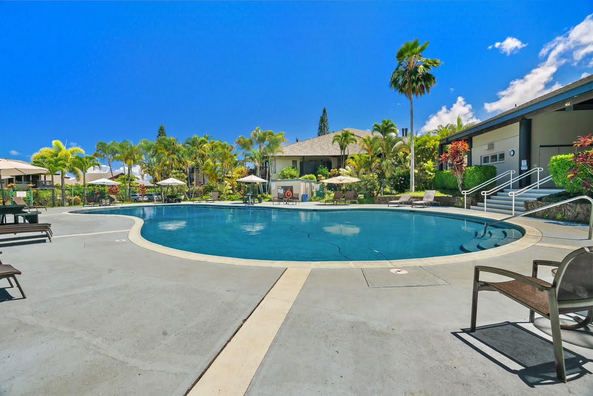 3920 Wyllie Road, Unit F20 Princeville, HI 96722 - Photo 23 of 25 a view of a swimming pool with a yard
