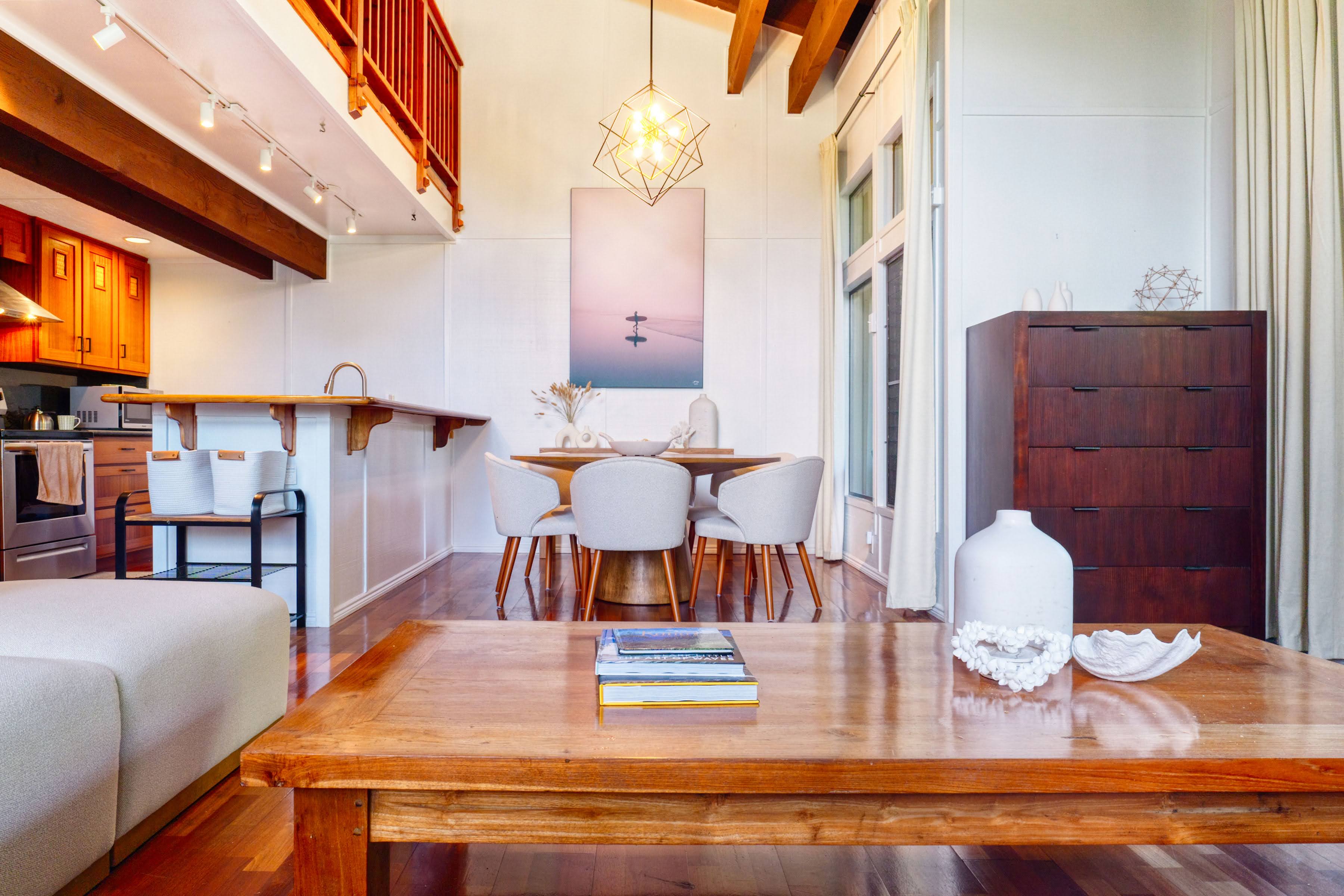 3920 Wyllie Road, Unit F20 Princeville, HI 96722 - Photo 3 of 25 a living room with furniture and wooden floor