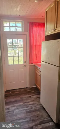 a white refrigerator freezer sitting inside of a kitchen