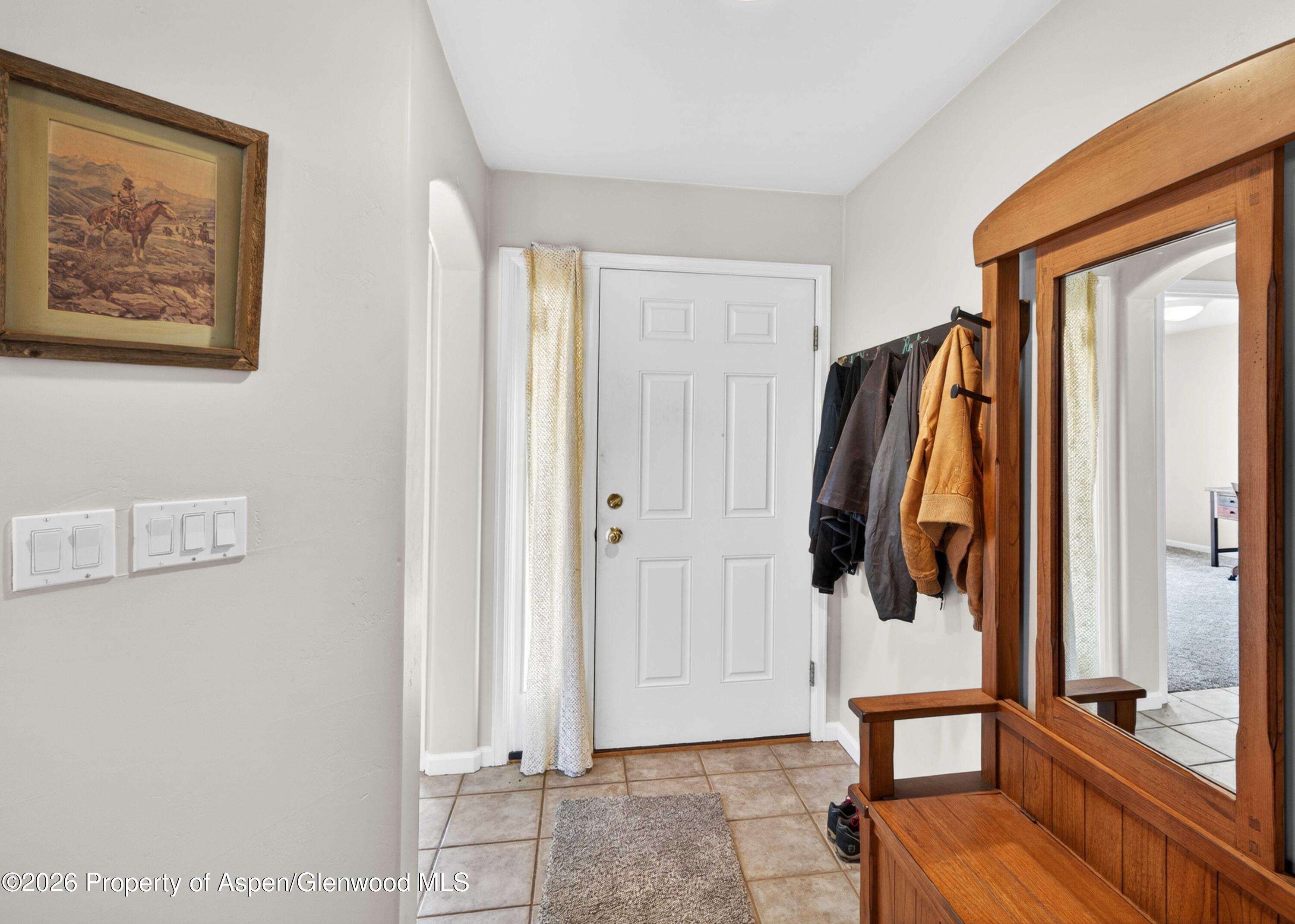 608 Lariat Loop New Castle, CO 81647 - Photo 12 of 32 a view of walk in closet with clothes and shoes