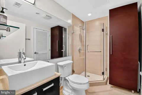 a bathroom with a sink toilet and shower