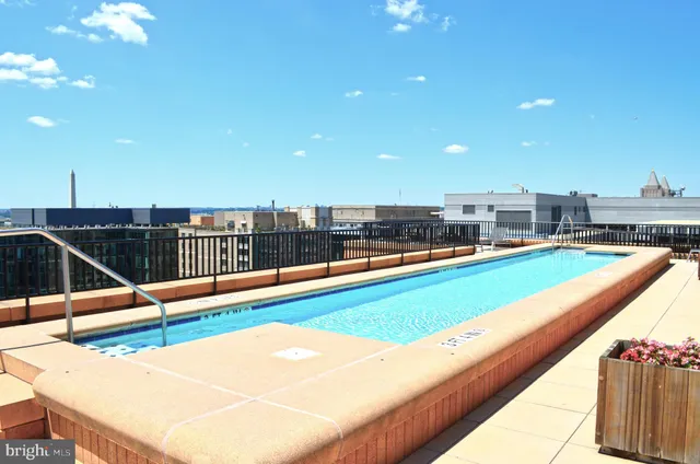a view of swimming pool with seating space