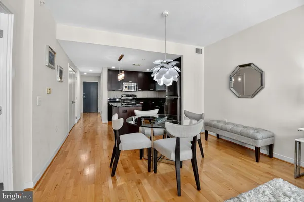 a view of a dining room with furniture and wooden floor