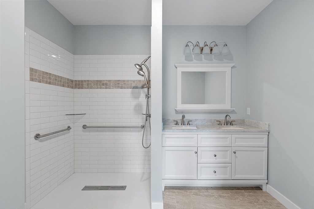94 Fitchburg Road, Unit 3 Townsend, MA 01469 - Photo 15 of 37 a bathroom with a shower sink and mirror