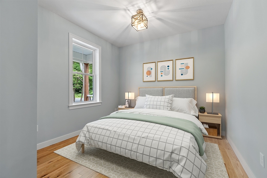 94 Fitchburg Road, Unit 3 Townsend, MA 01469 - Photo 17 of 37 a bedroom with a bed and a window