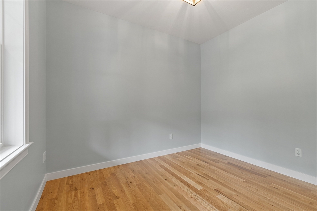 94 Fitchburg Road, Unit 3 Townsend, MA 01469 - Photo 24 of 37 a view of empty room with wooden floor