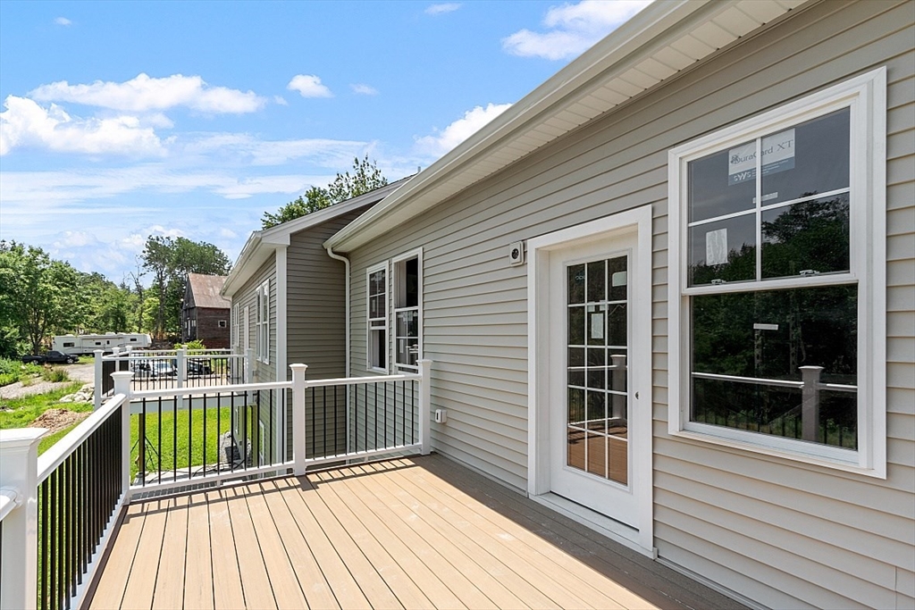 94 Fitchburg Road, Unit 3 Townsend, MA 01469 - Photo 30 of 37 a house view with a balcony