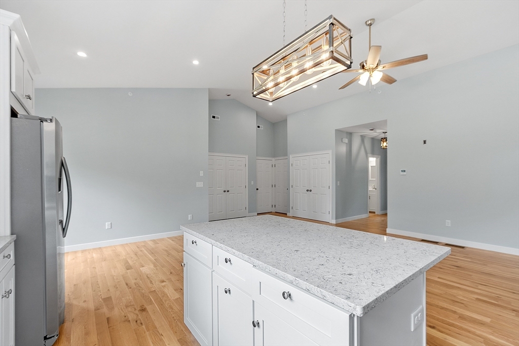 94 Fitchburg Road, Unit 3 Townsend, MA 01469 - Photo 4 of 37 an empty room with wooden floor