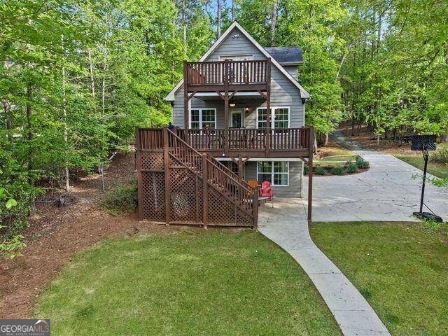 1150 Kings Row Road Greensboro, GA 30642 - Photo 1 of 1 a front view of a house with a yard and potted plants