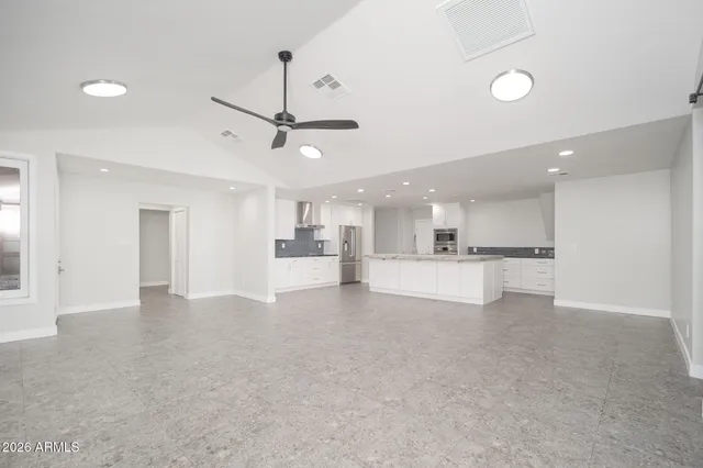a view of a kitchen with a sink and a window