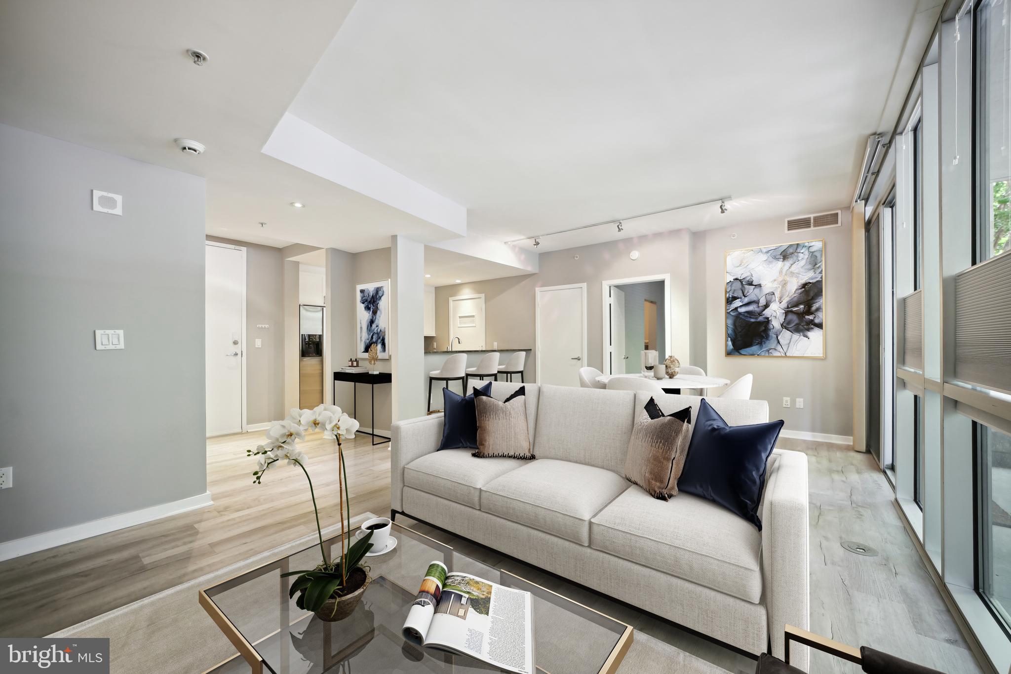 a living room with furniture and a table