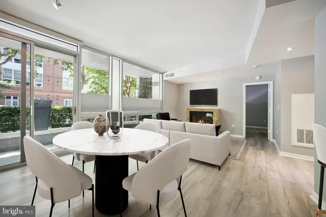 a view of a dining room with furniture window and wooden floor