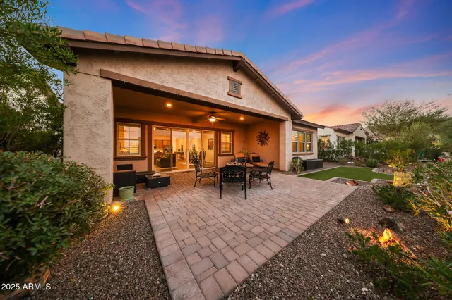 a kitchen with granite countertop cabinets and window