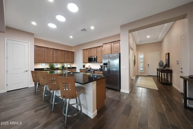 a bedroom with a bed and a large mirror