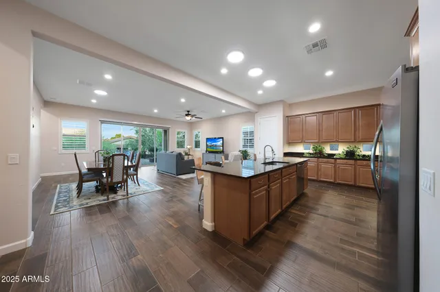 a view of a patio with table and chairs and potted plants