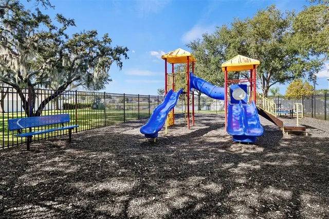 a view of a pathway with a garden