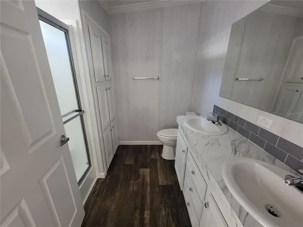 a bathroom with a sink and a large mirror