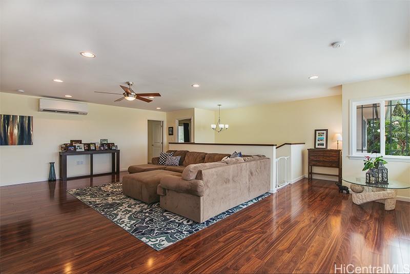 1381 A Akalani Loop, Unit 2 Kailua, HI 96734 - Photo 1 of 1 a living room with furniture and a wooden floor